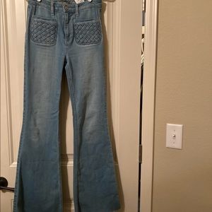 Flared jeans with frayed hem